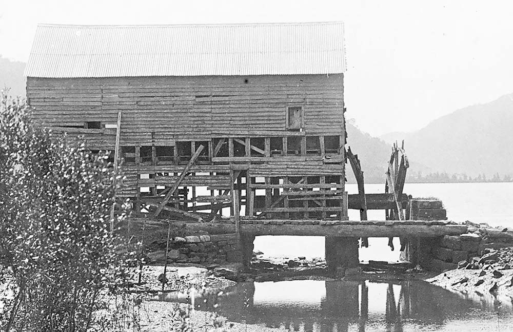 A photograph Singletons Mill at Laybury Creek, Wisemans Ferry NSW, towards the end of its life in the 1900s