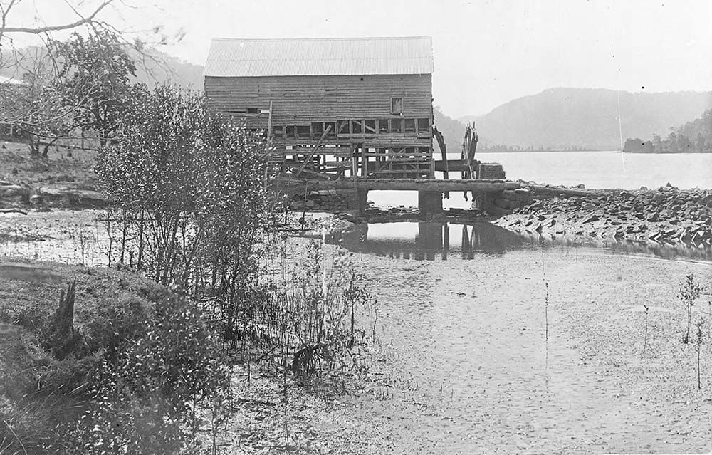 A photograph Singletons Mill at Laybury Creek, Wisemans Ferry NSW, towards the end of its life in the 1900s