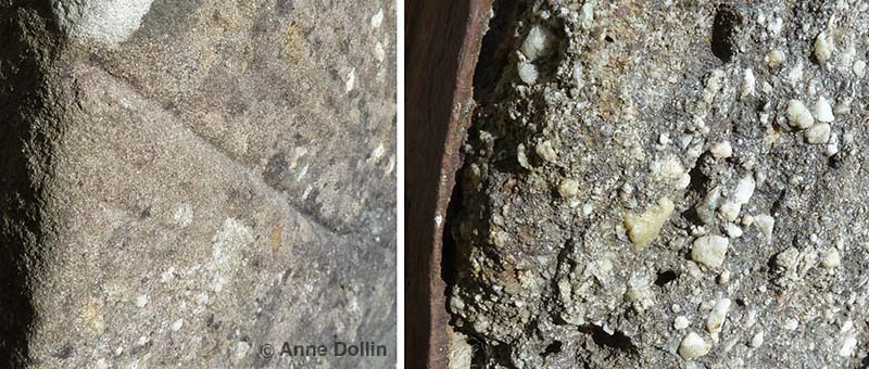 Detail of the two millstones on display at Carew Castle in Wales, UK. The sandstone millstone contains fine uniform sandy grains. The conglomerate millstone contains large white pebbles embedded in a grey fine-grained matrix.