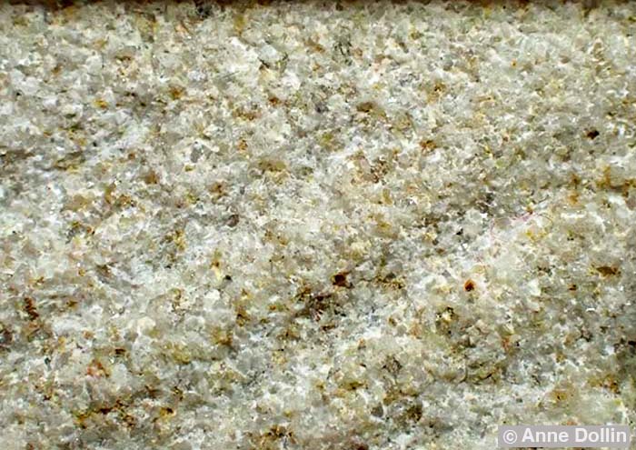 Macro photograph by Anne Dollin showing the surface of a millstone made from granulated French Burr Stone.